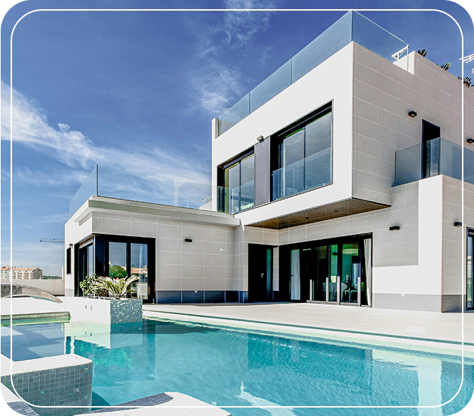 A large white house with a pool in the middle of it.